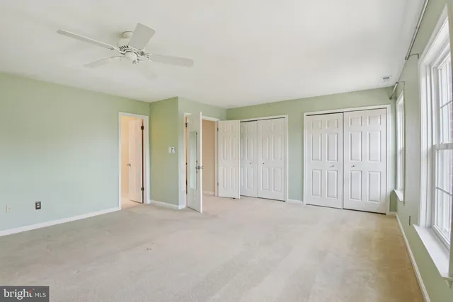 a view of an empty room and a window