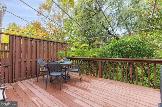 a view of balcony with furniture and wooden floor