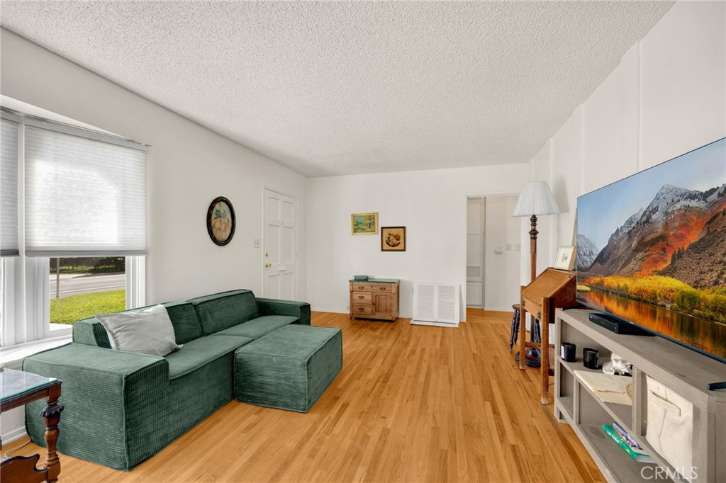4577 Ranger Avenue El Monte, CA 91731 - Photo 11 of 25 a living room with furniture and a wooden floor