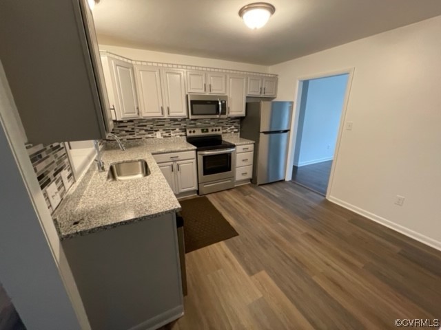 2139 Coxendale Road Chester, VA 23831 - Photo 3 of 15 a kitchen with a sink a microwave a refrigerator and cabinets