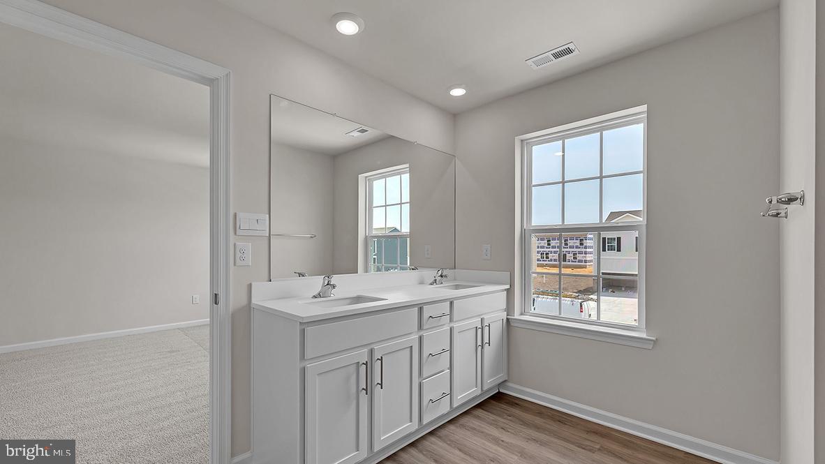 155 Littleworth Road Manahawkin, NJ 08050 - Photo 18 of 32 a bathroom with a sink and a window