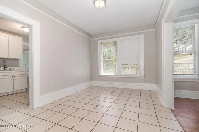 a view of an empty room and window