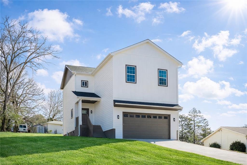 112 Neal Avenue Stockbridge, GA 30281 - Photo 1 of 19 a front view of house with yard