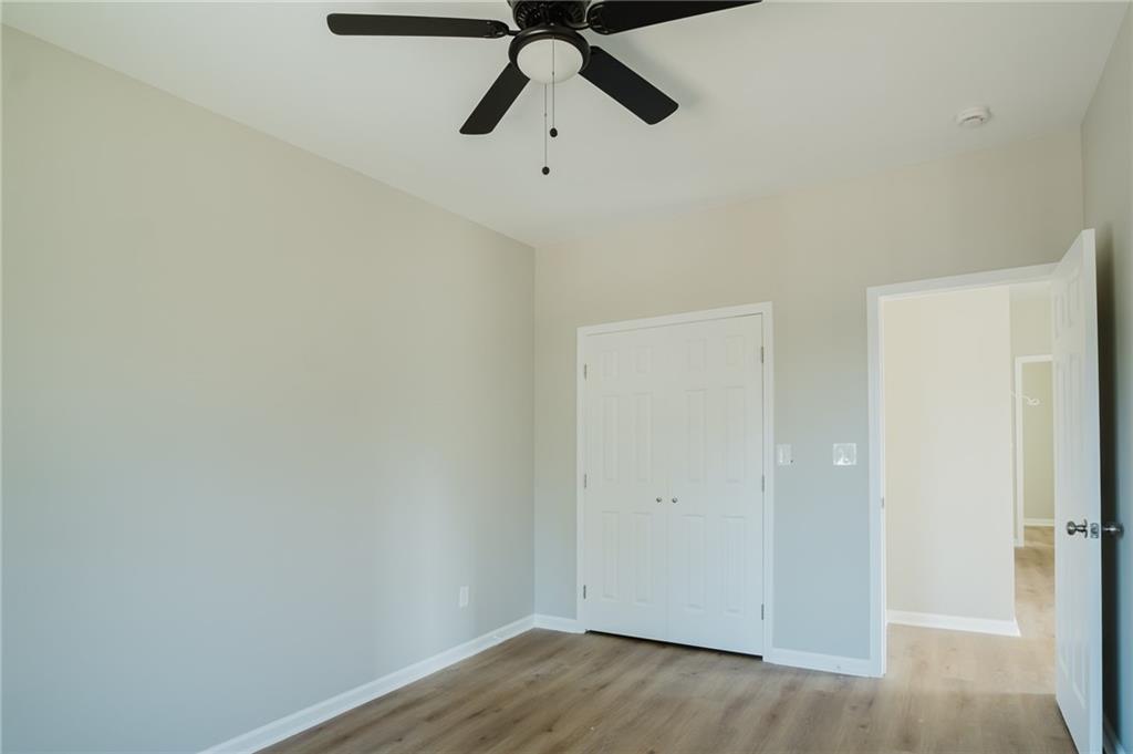 112 Neal Avenue Stockbridge, GA 30281 - Photo 18 of 19 a view of a room with wooden floor
