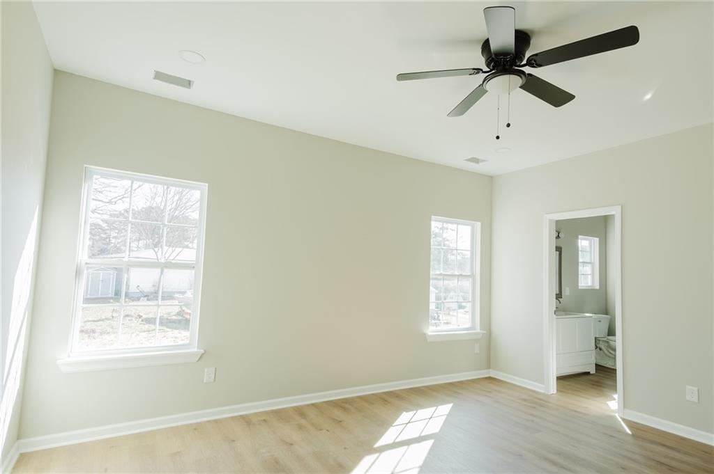 112 Neal Avenue Stockbridge, GA 30281 - Photo 10 of 19 a view of an empty room with a window