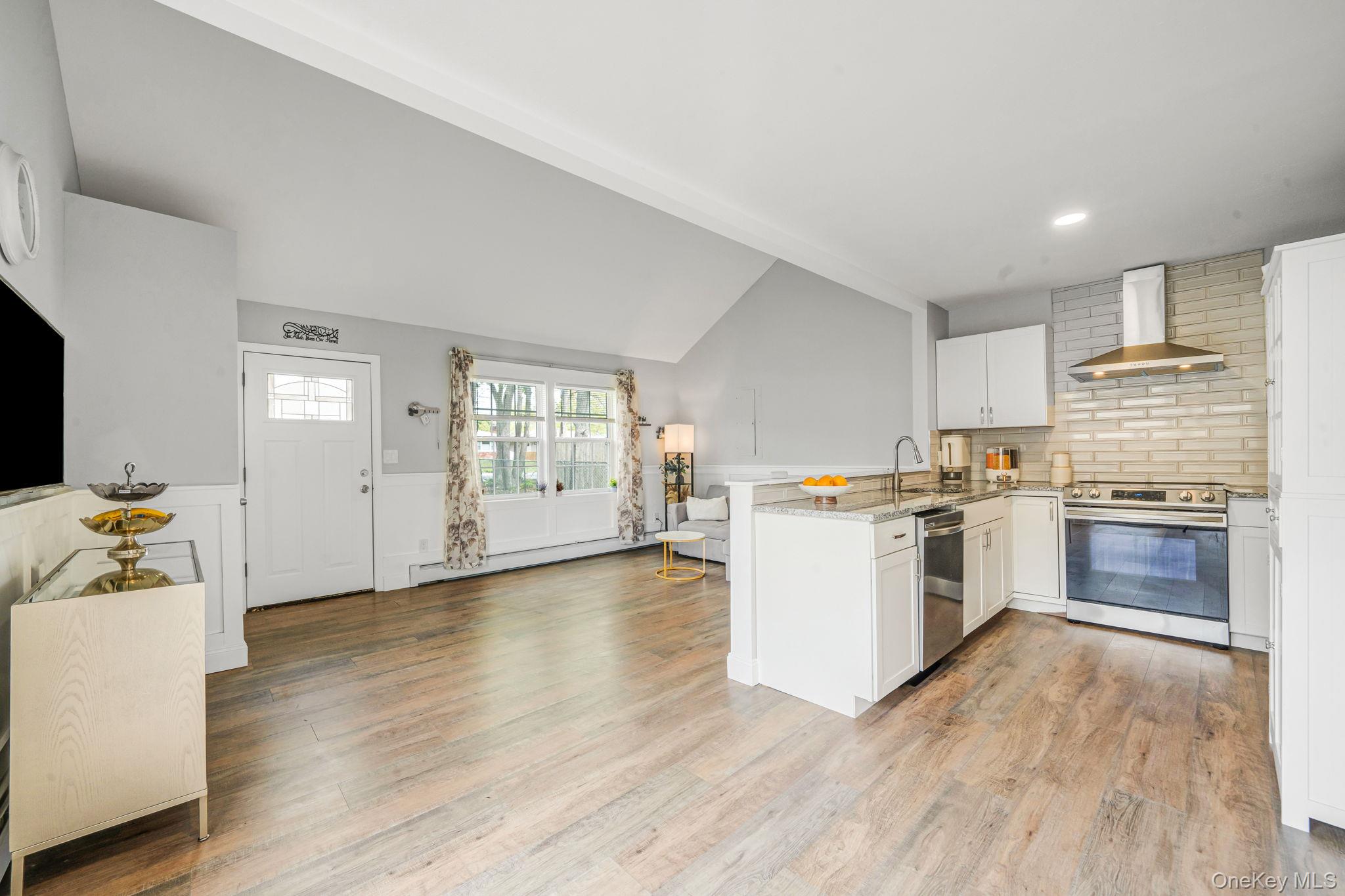 332 Commack Road Shirley, NY 11967 - Photo 13 of 25 a kitchen with a refrigerator and a stove top oven
