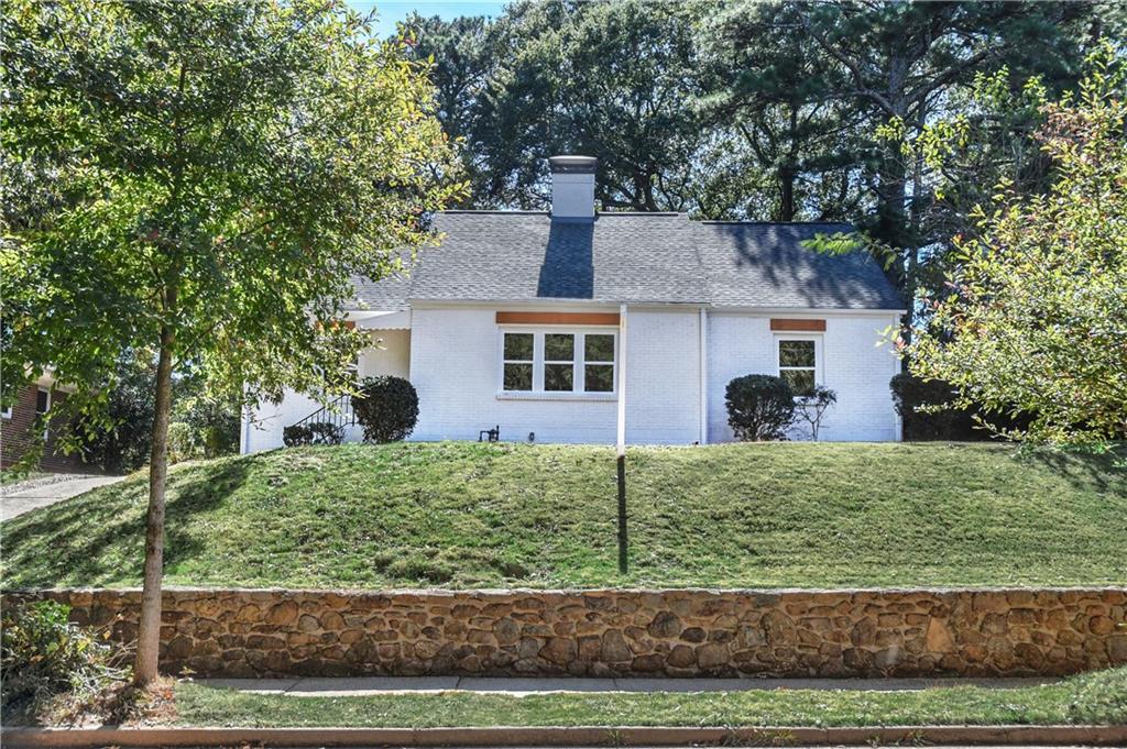 458 Shannon Drive Southwest Atlanta, GA 30310 - Photo 1 of 28 a front view of a house with a yard