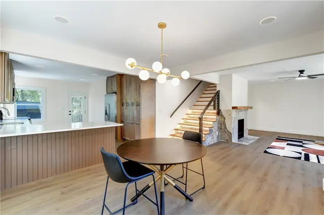 a view of a dining room with furniture and wooden floor
