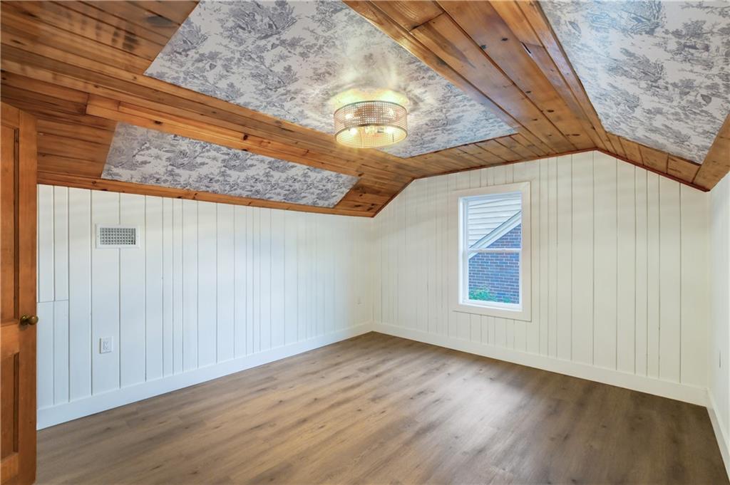 458 Shannon Drive Southwest Atlanta, GA 30310 - Photo 22 of 28 a view of an empty room with wooden floor and a window
