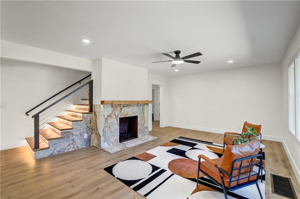 458 Shannon Drive Southwest Atlanta, GA 30310 - Photo 5 of 28 a work room with furniture and a fireplace