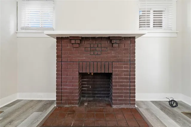a room with fireplace and windows