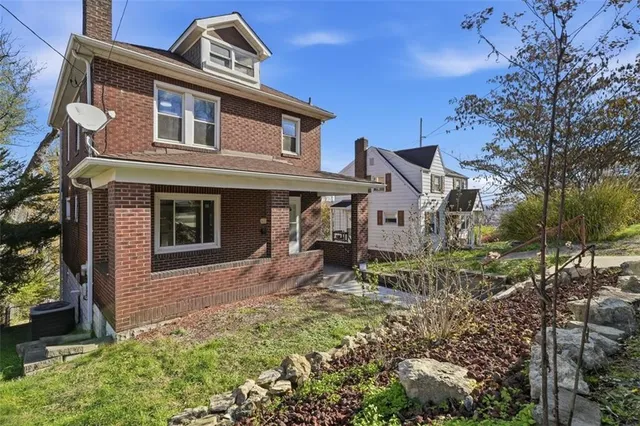 front view of a house with a yard