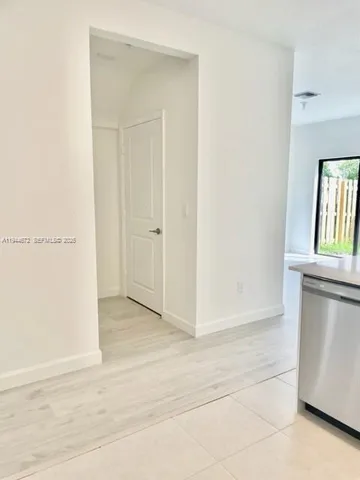 a view of an empty room and window