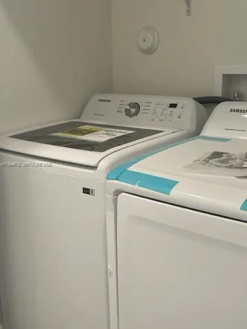 a utility room with dryer and washer