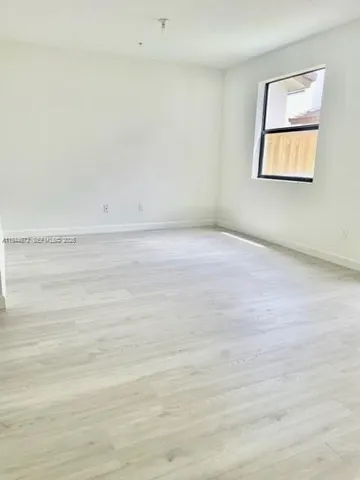 a view of a room that has a window