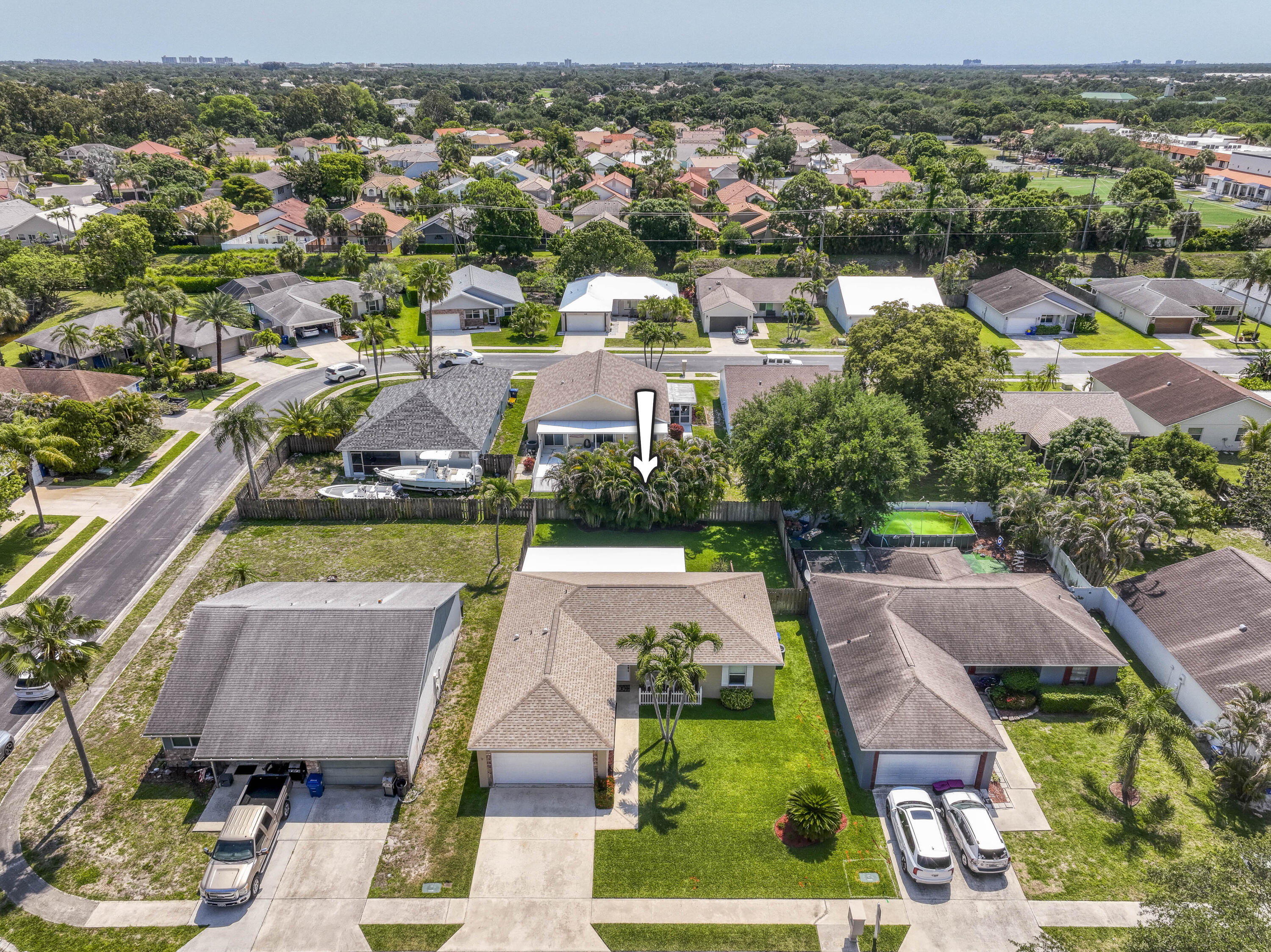 108 Wandering Trail Jupiter, FL 33458 - Photo 32 of 34 an aerial view of residential houses with outdoor space and swimming pool