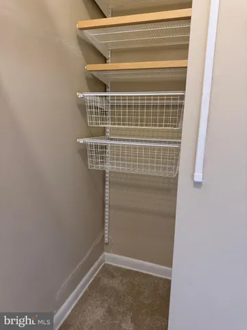 a kitchen with granite countertop cabinets and a stove top oven