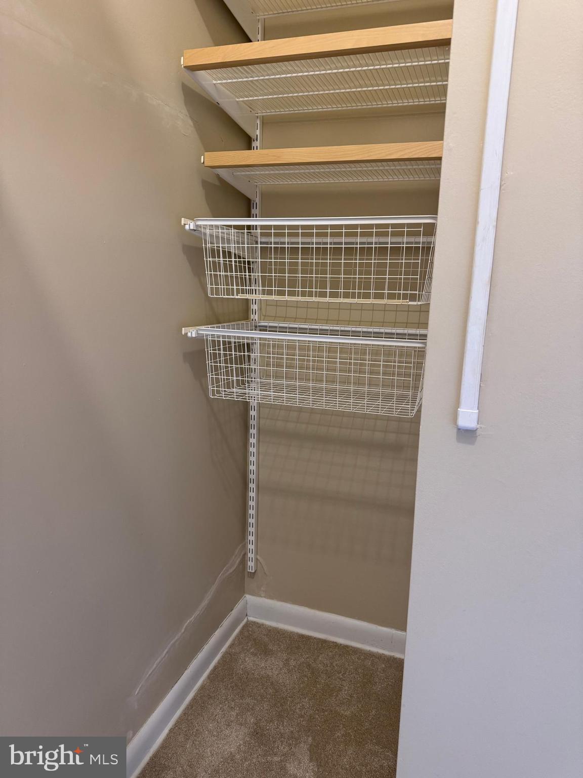 11 Slade Avenue, Unit 715 Baltimore, MD 21208 - Photo 14 of 48 a view of staircase with white door