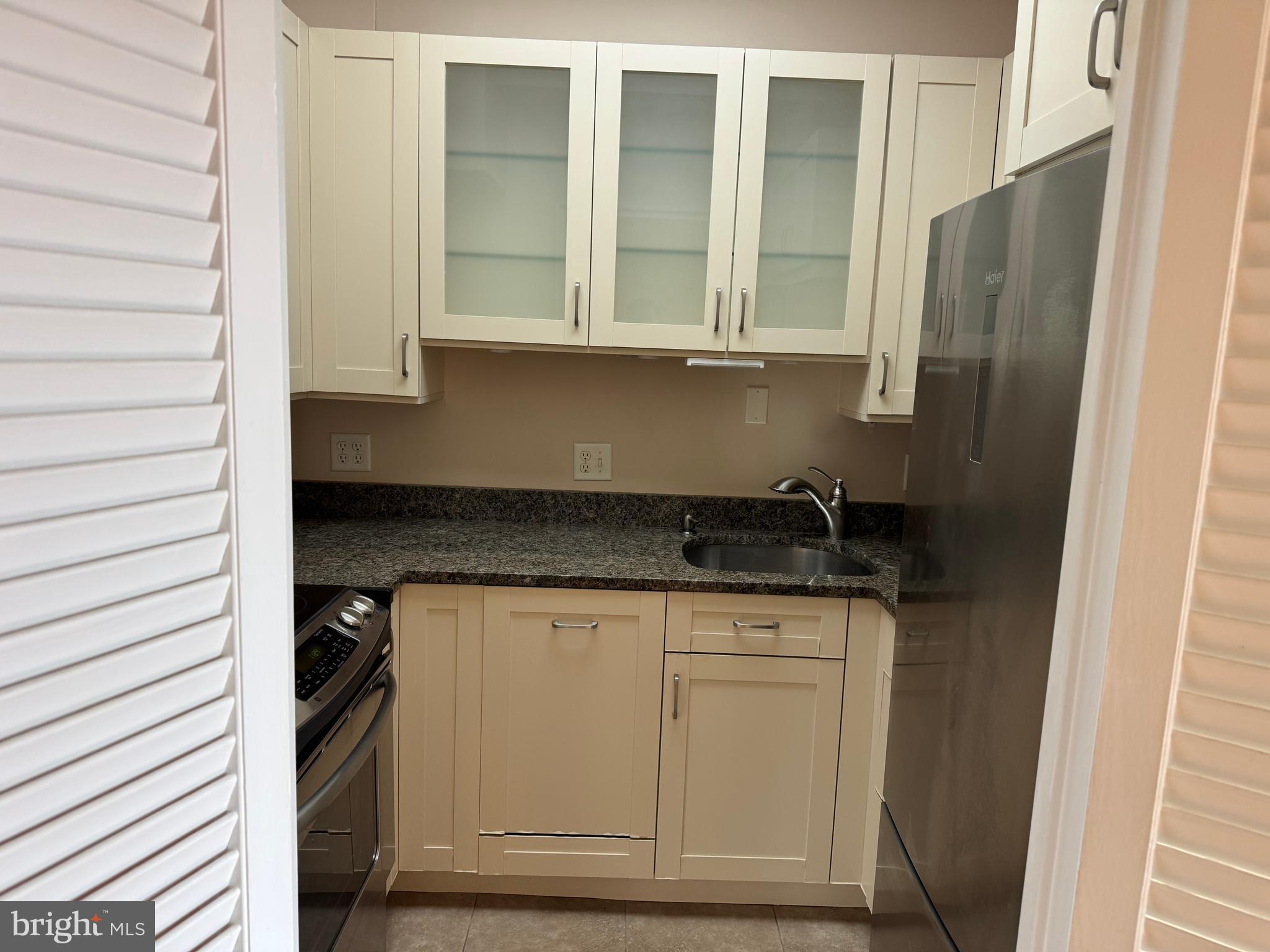 11 Slade Avenue, Unit 715 Baltimore, MD 21208 - Photo 17 of 48 a close view of wooden cabinets