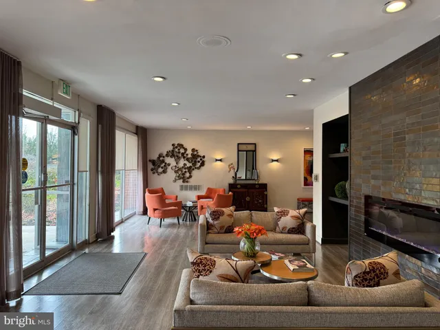 a living room with kitchen island furniture and a wooden floor
