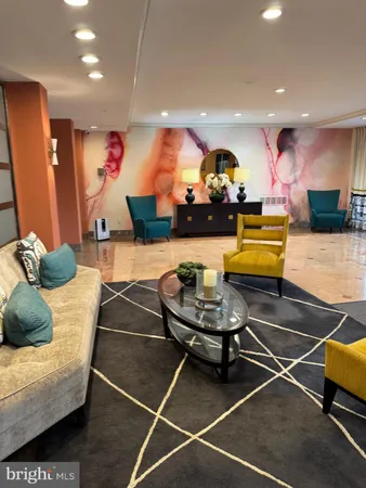 a book room with a book shelf and a couch