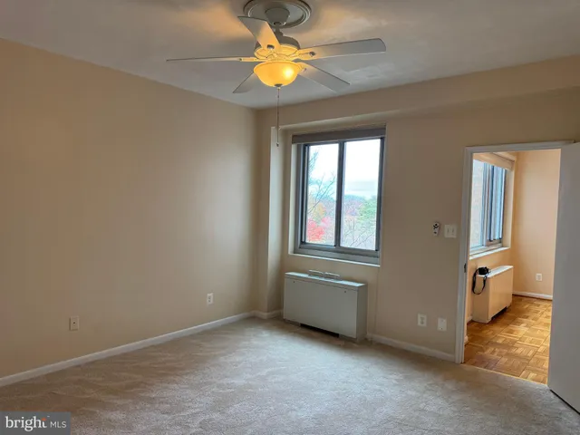 a view of an empty room with a closet