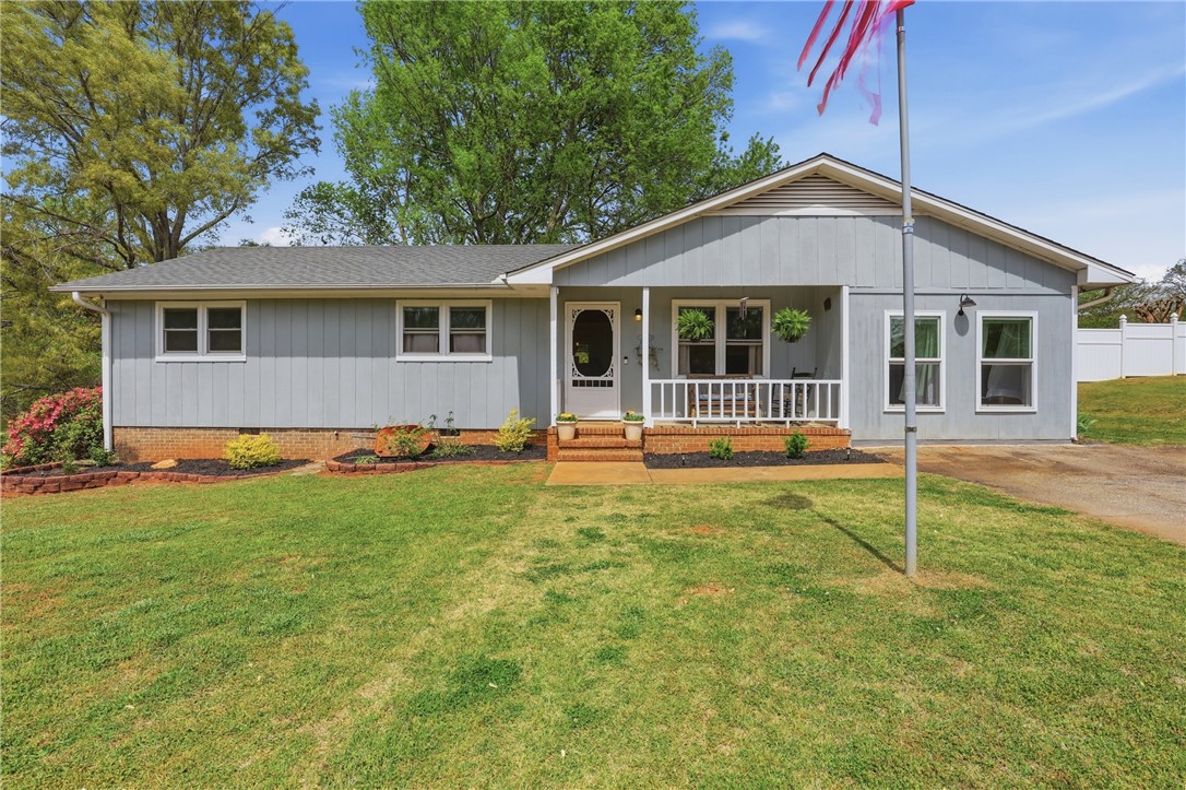 904 New Prospect Church Road Anderson, SC 29625 - Photo 1 of 31 This charming home offers a welcoming facade with a cozy front porch and well-maintained landscaping.