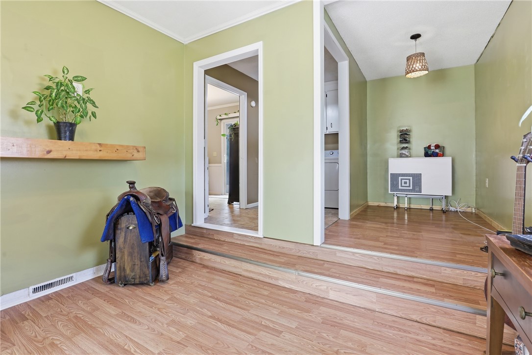 904 New Prospect Church Road Anderson, SC 29625 - Photo 12 of 31 This interior space features durable flooring and multiple open doorways, offering functional transitions between rooms.
