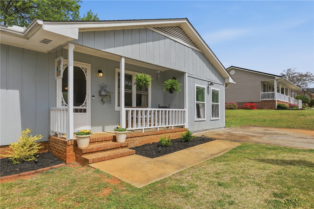 904 New Prospect Church Road Anderson, SC 29625 - Photo 2 of 31 This charming home offers a welcoming front porch, perfect for enjoying peaceful outdoor moments.