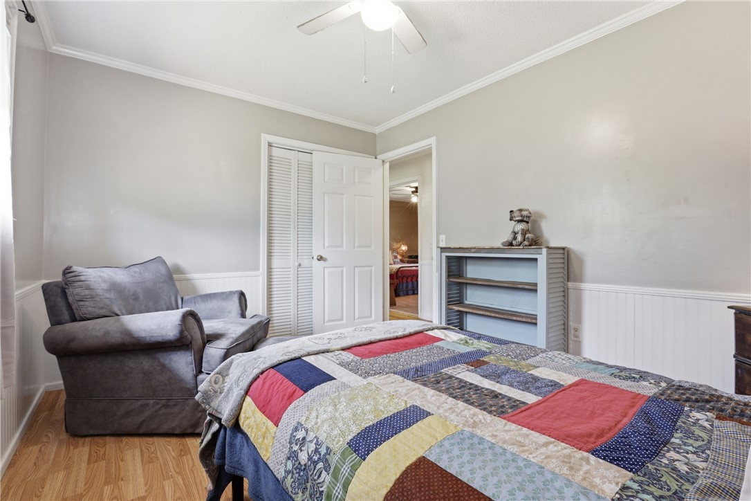 904 New Prospect Church Road Anderson, SC 29625 - Photo 22 of 31 This cozy bedroom features light walls and classic crown molding, offering a comfortable personal space.