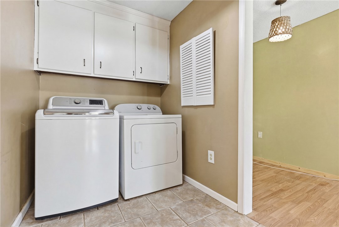 904 New Prospect Church Road Anderson, SC 29625 - Photo 23 of 31 This dedicated laundry space offers convenience and ample storage for daily chores.