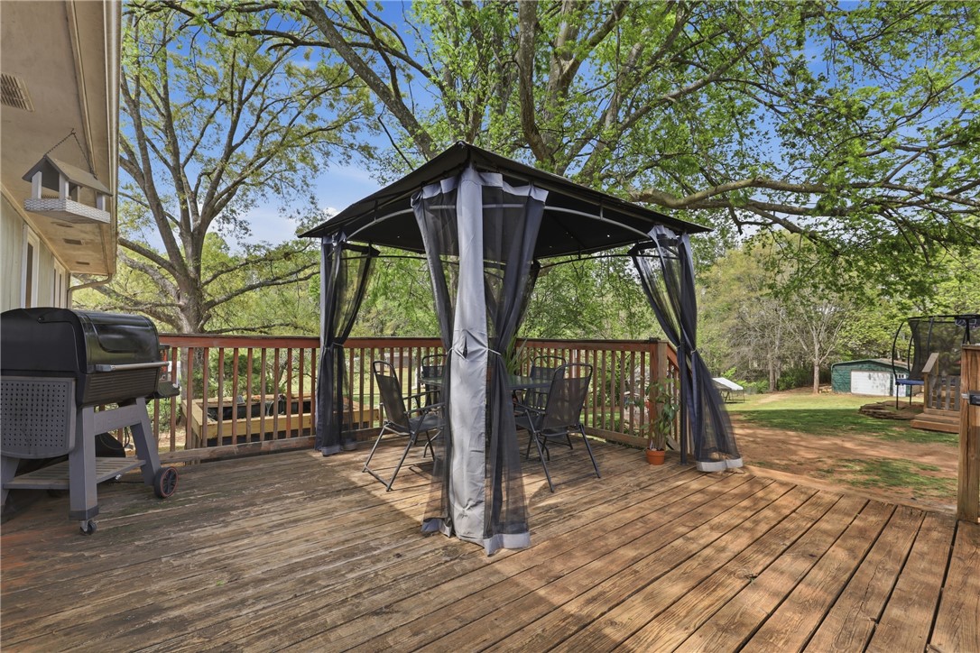 904 New Prospect Church Road Anderson, SC 29625 - Photo 24 of 31 This spacious wooden deck with a gazebo is ideal for outdoor gatherings.