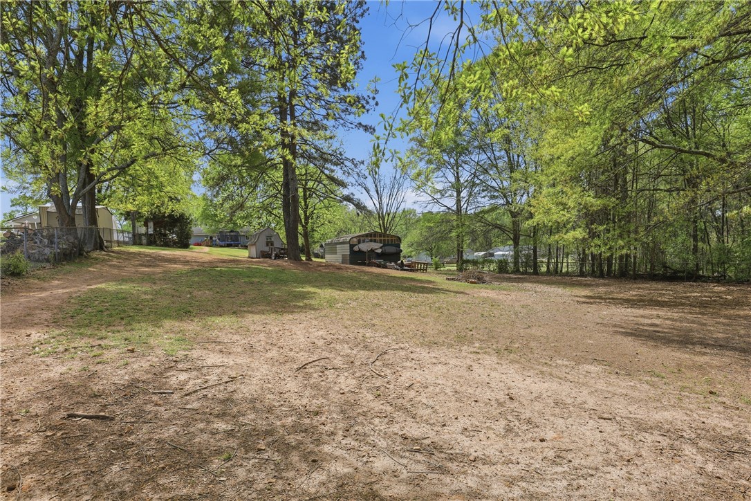 904 New Prospect Church Road Anderson, SC 29625 - Photo 26 of 31 Expansive lot with mature trees offers endless possibilities for outdoor enjoyment.