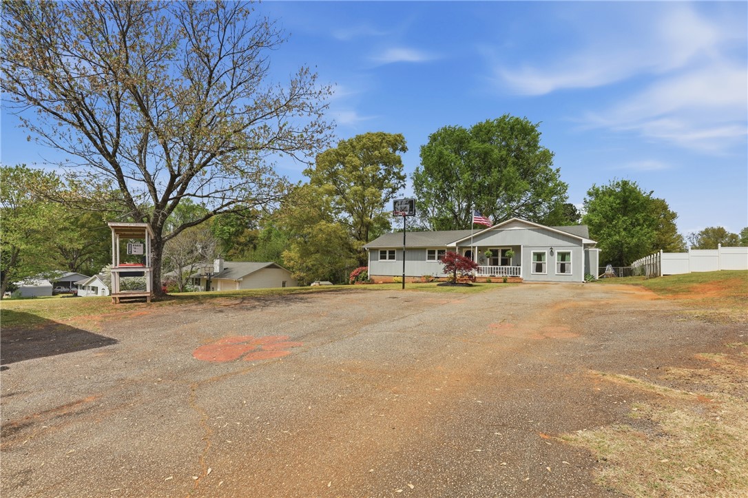 904 New Prospect Church Road Anderson, SC 29625 - Photo 30 of 31 This charming home features a welcoming porch, a spacious yard, and ample parking.