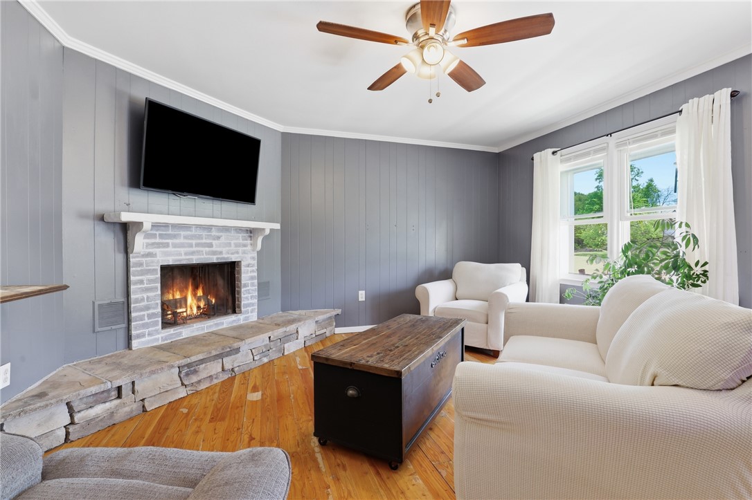 904 New Prospect Church Road Anderson, SC 29625 - Photo 4 of 31 This inviting living area features a warm fireplace and abundant natural light, perfect for relaxation.