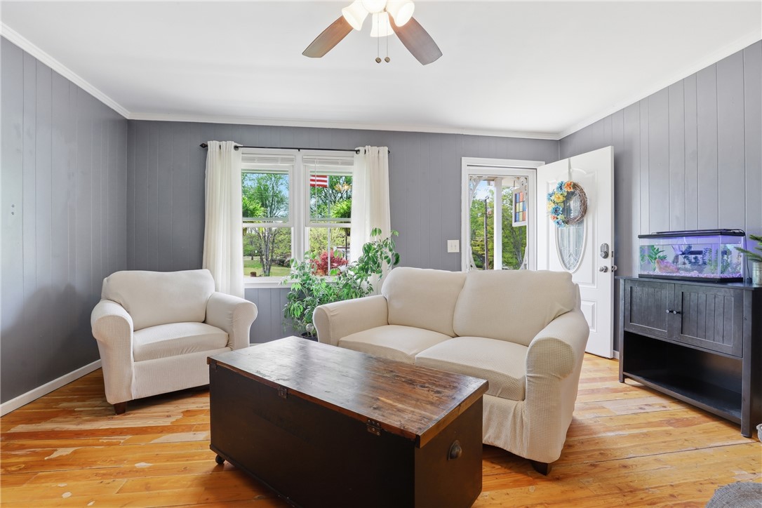 904 New Prospect Church Road Anderson, SC 29625 - Photo 6 of 31 This inviting living space features warm wood flooring and abundant natural light.