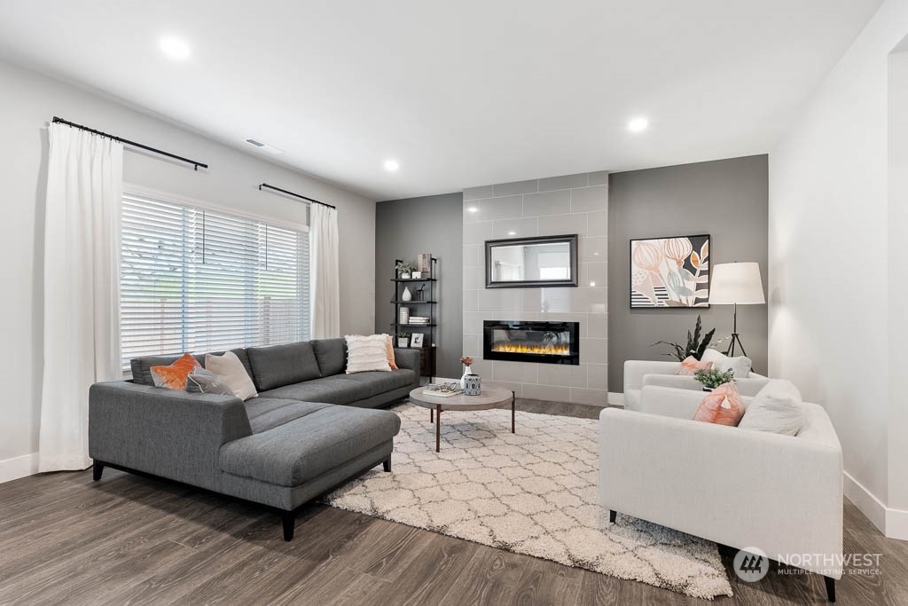 117 177th St S Street West Bothell, WA 98012 - Photo 11 of 32 a living room with furniture and a fireplace