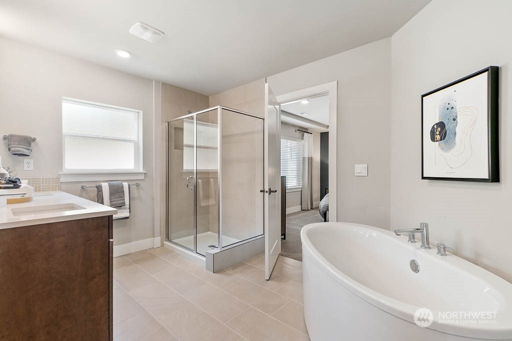 117 177th St S Street West Bothell, WA 98012 - Photo 23 of 32 a bathroom with a tub sink shower and mirror