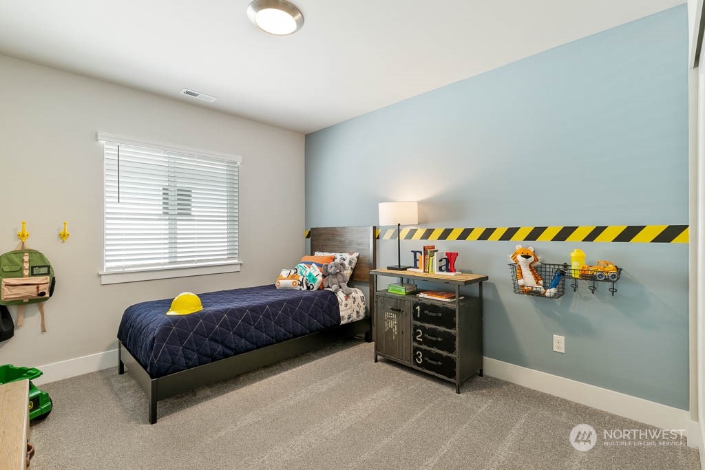 117 177th St S Street West Bothell, WA 98012 - Photo 29 of 32 a bedroom with bed and window