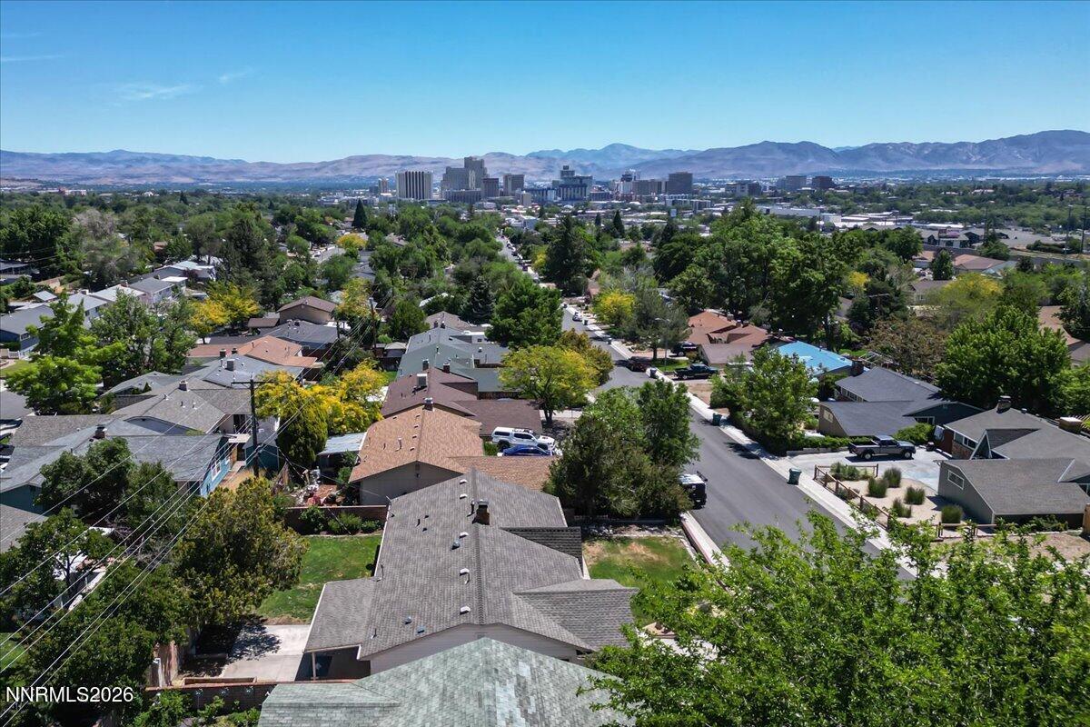 2205 Carlin Street Reno, NV 89503 - Photo 40 of 51 an aerial view of a city with lots of residential buildings and mountain view in back