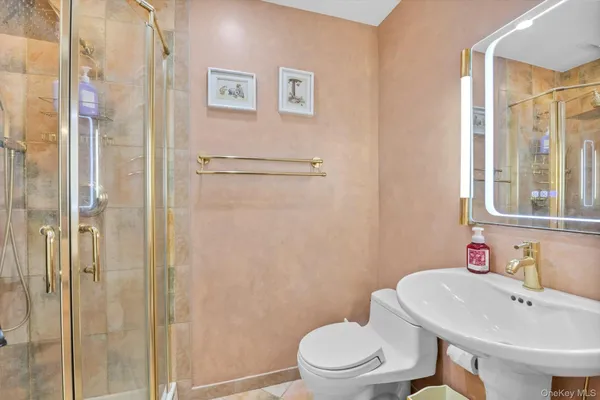 a white toilet sitting next to a bathroom sink