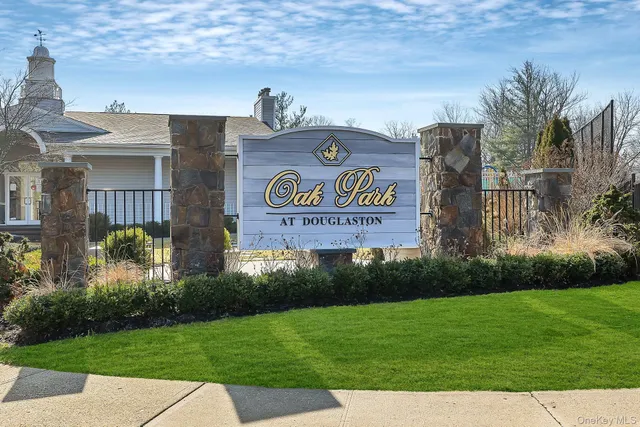a view of a street with a building and a park