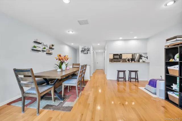 a view of a dining room with furniture and a wooden floor