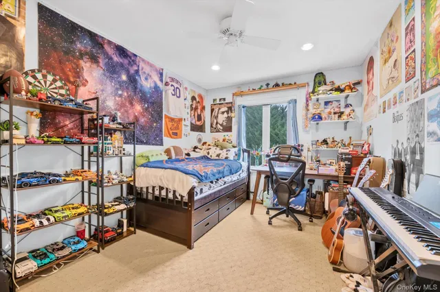 a living room with furniture and a book shelf
