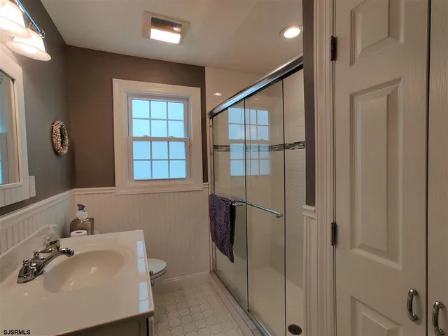 a bathroom with a sink and shower
