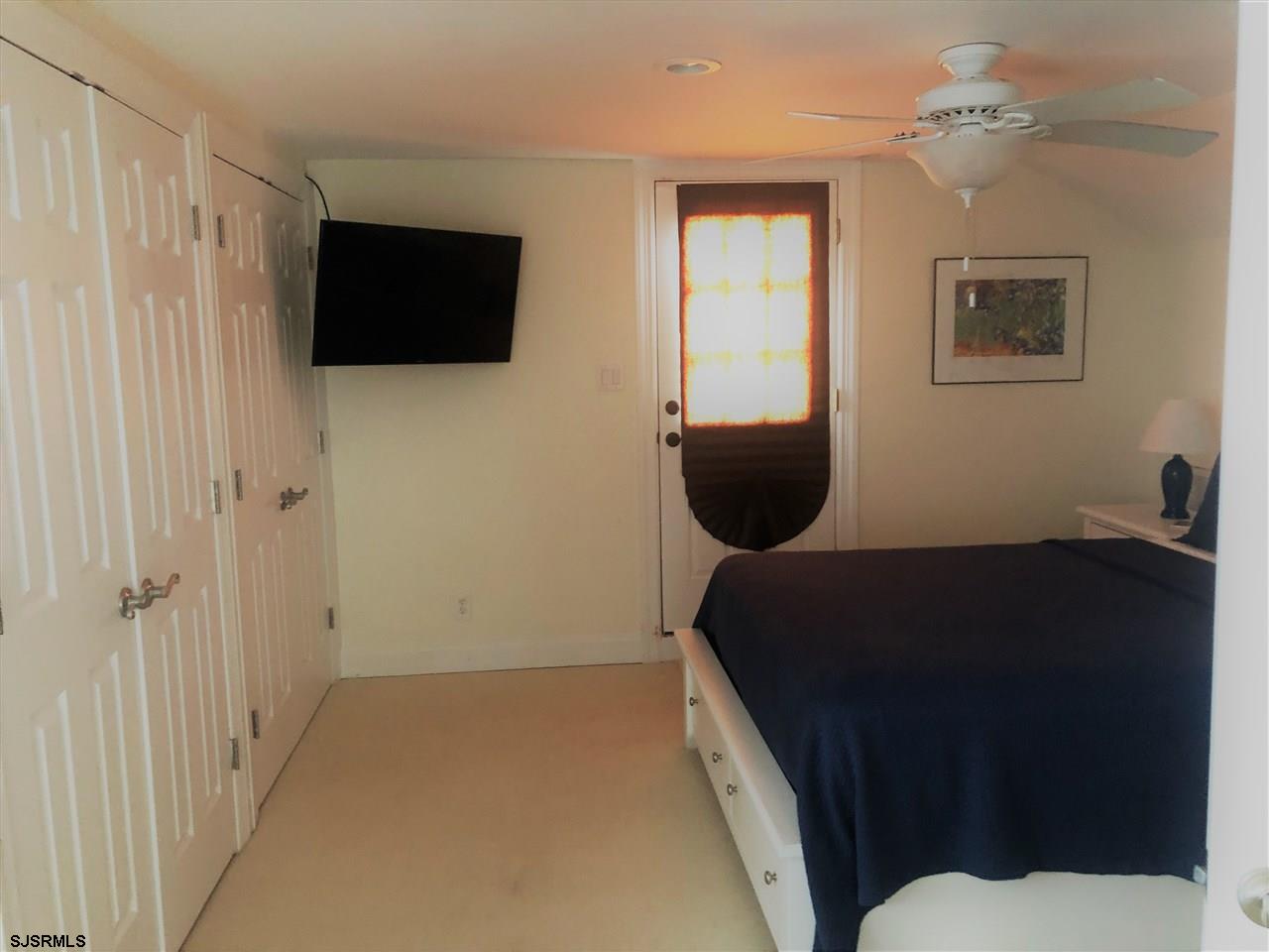 5806 Ventnor Avenue Ventnor City, NJ 08406 - Photo 15 of 25 a living room with furniture and a flat screen tv