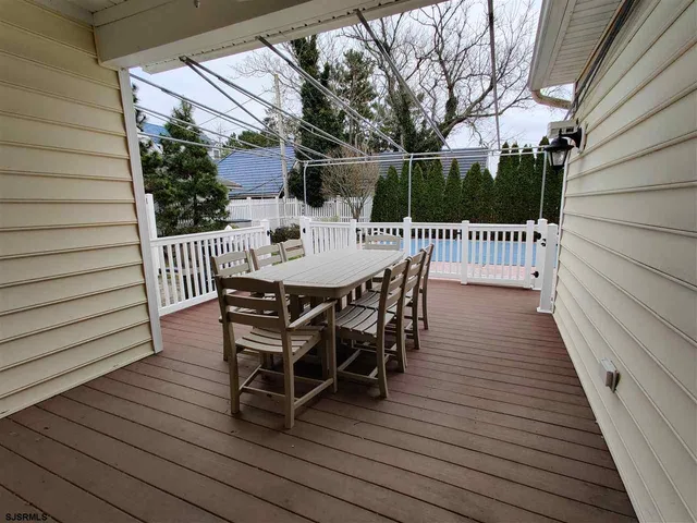 a view of a deck with furniture