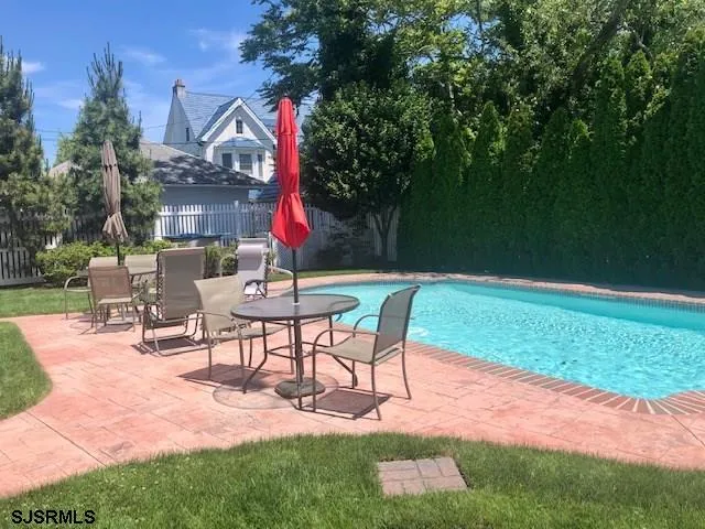 a view of a backyard with sitting area