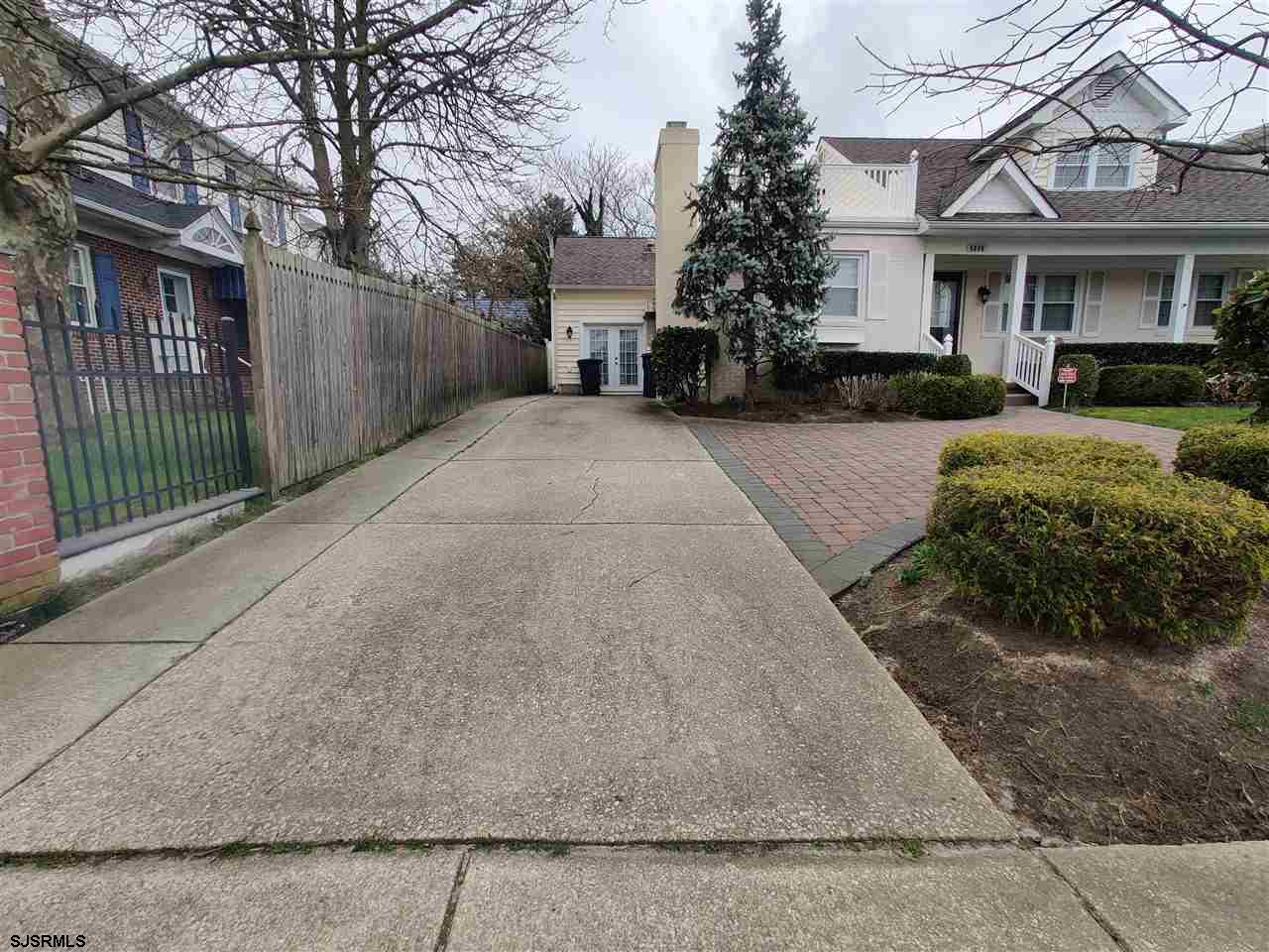 5806 Ventnor Avenue Ventnor City, NJ 08406 - Photo 25 of 25 a view of a white house with a large tree in front of it