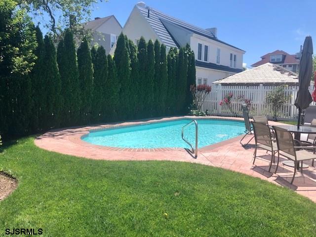 5806 Ventnor Avenue Ventnor City, NJ 08406 - Photo 3 of 25 a backyard of a house with table and chairs